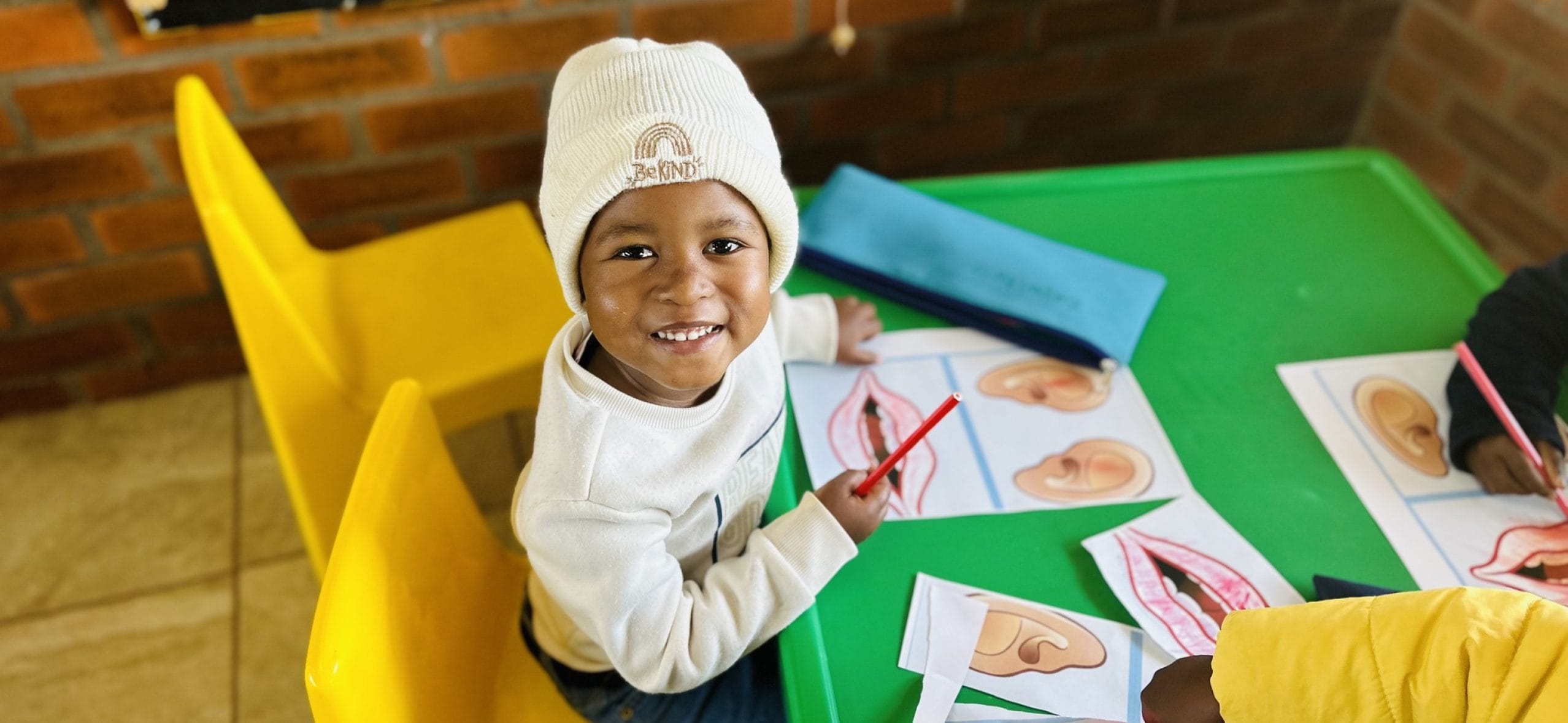 Child exploring cultural images and drawings.