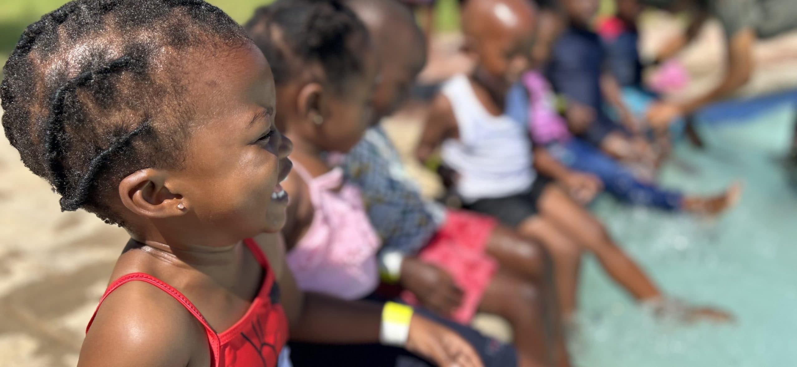 Children enjoying a poolside gathering.
