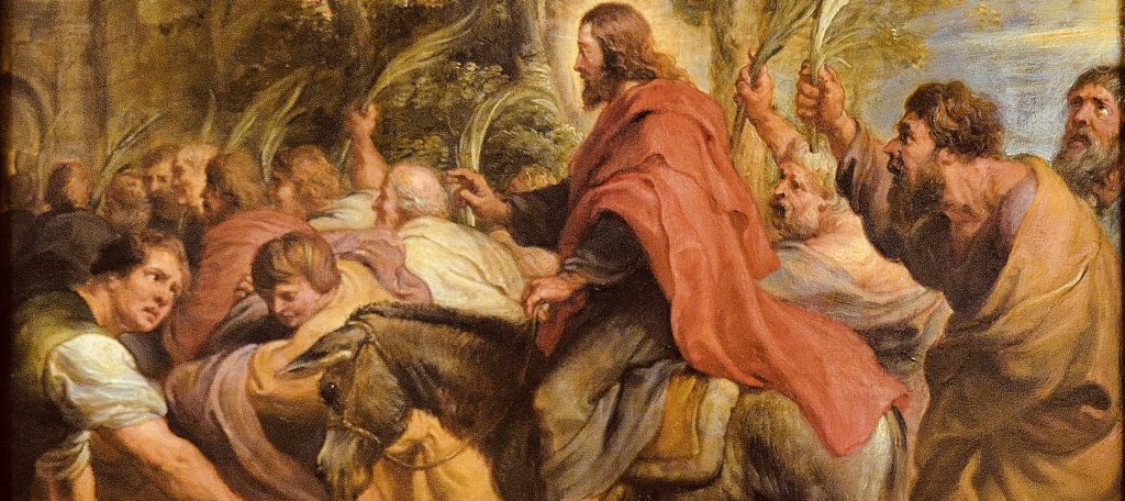 Jesus riding a donkey into Jerusalem, surrounded by followers and onlookers.