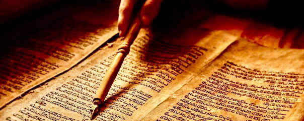 Old manuscript with a quill pen on aged paper for biblical study.