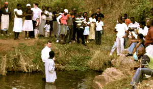 People participating in baptism ceremony at Trinity Baptist Church.
