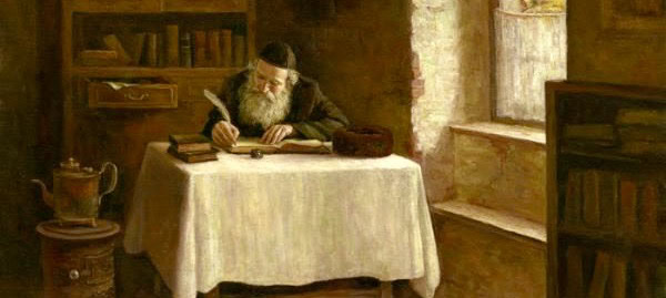 Elderly man with a long beard reading and writing at a desk in a cozy room.
