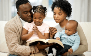 Family reading Bible together for spiritual bonding and harmony.