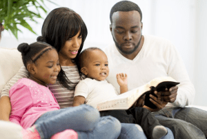 Family reading together promotes bonding and spiritual development.
