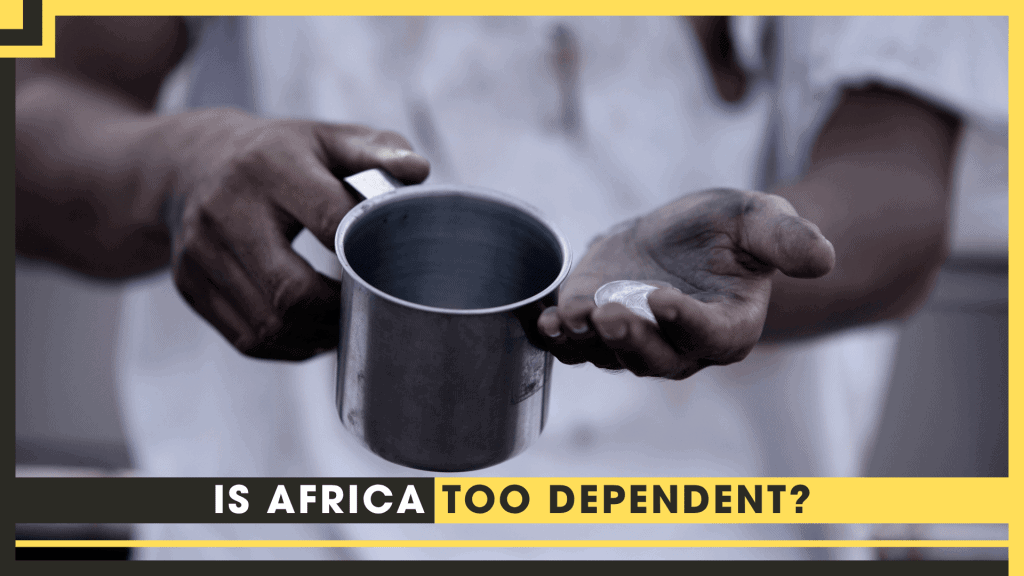Close-up of hands holding a metal cup, symbolizing dependence in Africa.