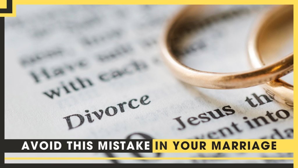 Close-up of a wedding ring on a document about divorce and marriage.